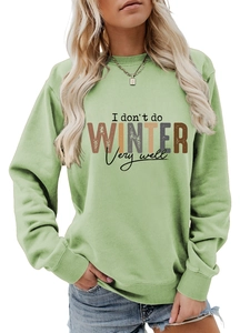 Detail of vintage I don't do winter very well letter print on light green sweatshirt
