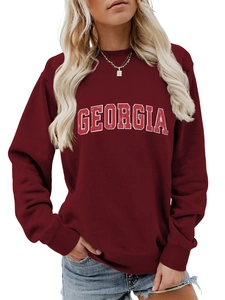 Detail of Georgia letter print on burgundy crewneck sweatshirt with ribbed cuffs