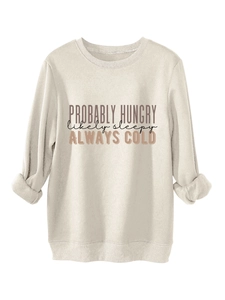 Detail of soft fleece fabric with PROBABLY HUNGRY slogan on cream sweatshirt