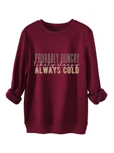 Close-up of burgundy fleece sweatshirt with Probably Hungry printed text and soft lining