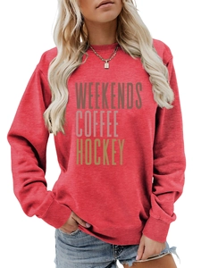 Detail of crew neck sweatshirt with Weekends Coffee Hockey print in dark red