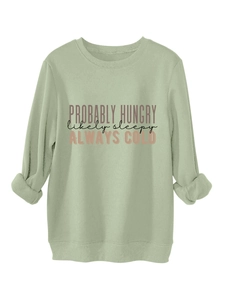 Detail of the PROBABLY HUNGRY text print on a green fleece sweatshirt for women