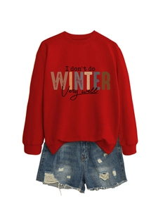 Flat lay of red crewneck sweatshirt with 'I don't do WINTER very well' text and denim shorts