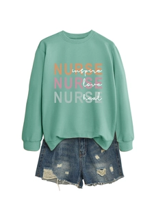 Mint green nurse sweatshirt with inspire love heal print paired with denim shorts