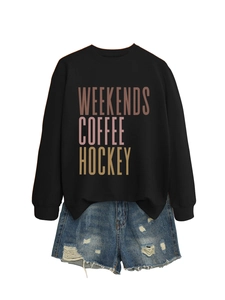 Close-up of Weekends Coffee Hockey lettering on black crewneck cotton sweatshirt