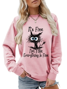 Detailed view of humor text and cat graphic on pink long sleeve crewneck sweatshirt