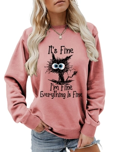 Close-up of the black cat print and funny slogan on pink long sleeve sweatshirt