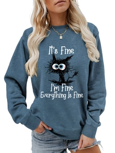 Close-up of ribbed neckline and black cat graphic print on dusty blue sweatshirt
