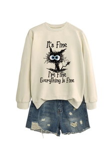 Flat lay of beige sweatshirt with cat graphic and It's Fine I'm Fine slogan design