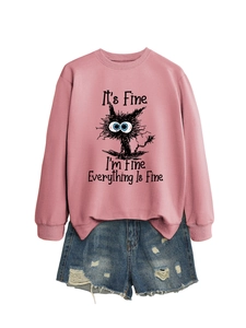 Detail of pink crewneck sweatshirt with cartoon cat print and ribbed cuffs and hem