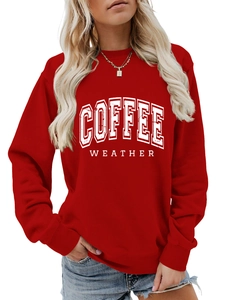 Detail view of red crewneck sweatshirt featuring white Coffee Weather vintage typography print
