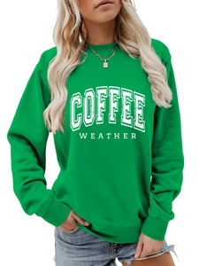 Detail of green long sleeve sweatshirt featuring white Coffee Weather distressed print