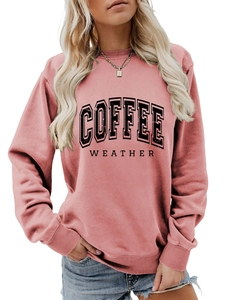 Detail of Coffee Weather print on rose pink crewneck sweatshirt with ribbed collar