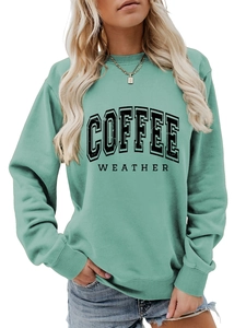 Detail of mint green sweatshirt with COFFEE WEATHER vintage print and ribbed cuffs