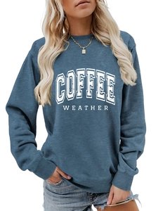 Detail of the blue Coffee Weather crewneck sweatshirt showing fabric texture and white print