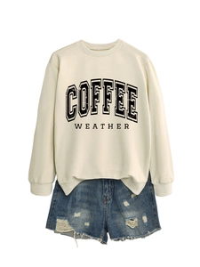 Detail of coffee weather sweatshirt in beige cotton paired with distressed denim shorts