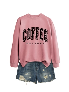 Flat lay of pink coffee weather crewneck sweatshirt with distressed denim shorts set