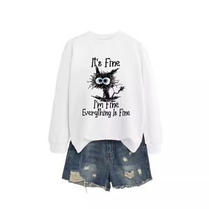 White pullover sweatshirt with funny cat print paired with distressed denim shorts