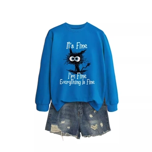 Funny cat print sweatshirt in royal blue paired with distressed denim shorts