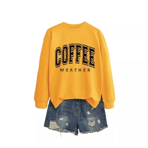 Yellow 'Coffee Weather' crewneck sweatshirt paired with blue distressed denim shorts