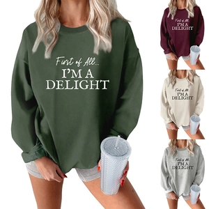 Detail of crewneck sweatshirt showing diverse colors and thick plush fabric texture