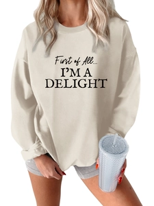 Detailed view of black gothic letter print on thick beige fleece oversized sweatshirt