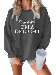 Detail of dark grey fleece sweatshirt featuring white letter print and ribbed crew neck