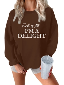 Detail of loose fit brown crewneck sweatshirt with First of All I'm a Delight text