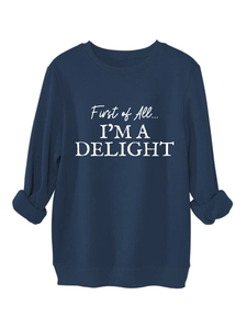 Detail of navy fleece sweatshirt showing rib-knit cuffs and white typography print