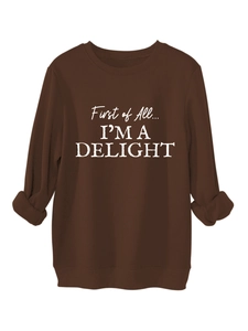 Detail view of the thick fleece ribbing and white letter print on a brown sweatshirt