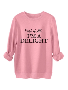 Close-up of pink sweatshirt featuring thick fleece fabric and First of All text print