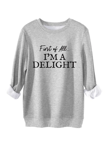 Detail of gray slogan sweatshirt showing warm white fleece lining at the folded cuff