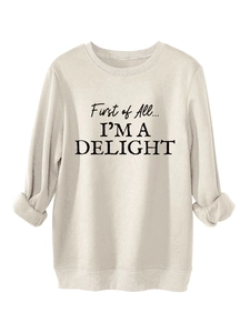 Close-up of ribbed cuffs and soft cream fleece fabric on this slogan sweatshirt
