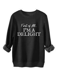 Detail of fleece lining on cuff of black crewneck sweatshirt with white printed text