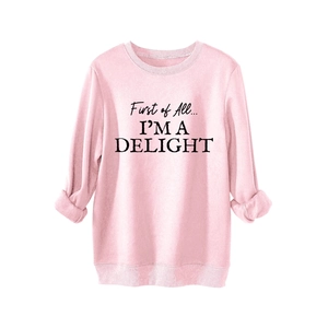 Pink crewneck sweatshirt featuring First of All I'm a Delight black text print design