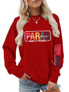 Detail of red sweatshirt showing chest logo print and slogan on the left sleeve