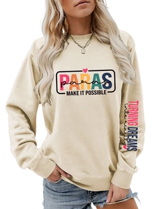 Detail of cream sweatshirt with colorful Paras print and sleeve typography text