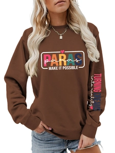 Detail of colorful Paras text print and slogan on a brown oversized sports sweatshirt