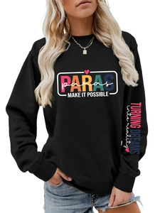 Detail of colorful arm print and chest graphics on black long sleeve crewneck sweatshirt