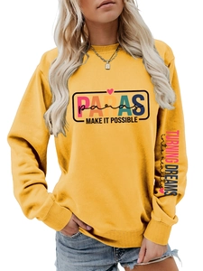 Detail of mustard yellow sweatshirt with colorful sleeve print and PARAS chest logo