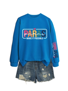 Detail of royal blue sweatshirt with colorful Paras print and ripped denim shorts