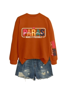 Close-up of rust orange sweatshirt with PARAS print and distressed denim shorts set