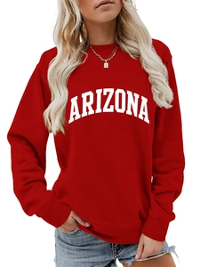 Detail of red oversized Arizona sweatshirt showing ribbed crewneck and white printed letters