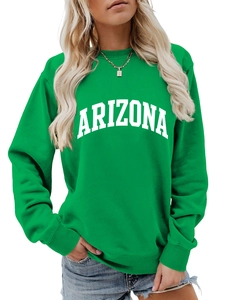 Close-up of ribbed cuffs and white Arizona lettering on a green crewneck sweatshirt