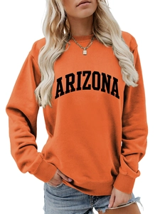 Detail of orange Arizona sweatshirt showing the ribbed cuffs and soft cotton knit fabric
