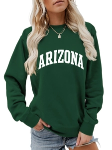 Close-up of the vintage Arizona white letter print on a dark green crewneck sweatshirt