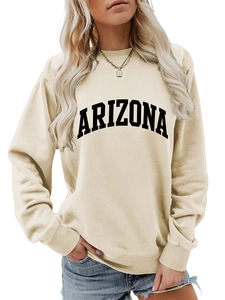 Macro detail of ribbed neckline and Arizona letter print on beige oversized sweatshirt