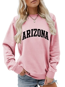 Detail of pink Arizona sweatshirt showing ribbed cuffs and black letter print textures
