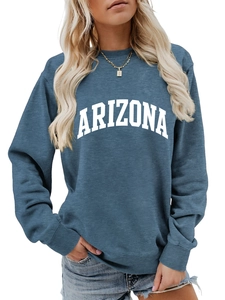 Close-up of the Arizona letter print and ribbed crew neck on the blue oversized sweatshirt