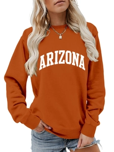 Close-up of burnt orange Arizona crewneck sweatshirt with white arched letter printing